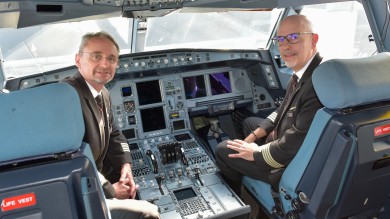 Captain Manfred Simon (left) with his team colleague after landing in Zurich.
