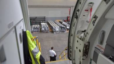 The photo was taken from inside the aircraft, through the open aircraft door. On the outside you can see numerous rows of seats that are waiting to be installed.
