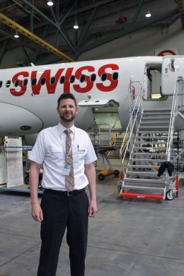 Stephan is staying at the Hangar in front of an airplane