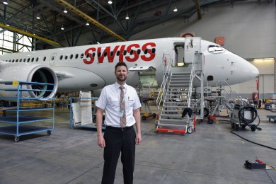 Stephan is staying at the Hangar in front of an airplane