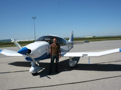 Jean Marc in front of airplane.