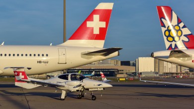 A SWISS aircraft, an Edelweiss aircraft and a training aircraft are posing together in Zurich. 