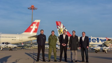 Posing in front of a SWISS aircraft and an Edelweiss aircraft.
