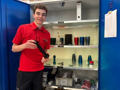 Marc proudly shows off a turbine-inspired pepper mill made in the workshop.