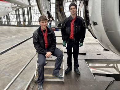 Sinan (left) and Engjell (right) are working in the hangar.