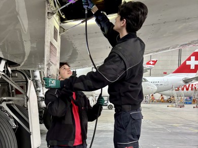 Sinan (left) and Engjell (right) are working in the hangar.