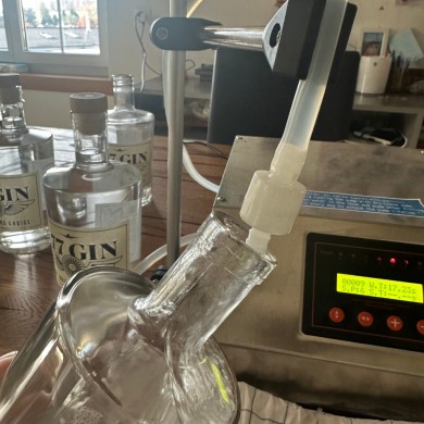 Measured, filled, and checked. Every step handled manually to ensure consistency across all 777 bottles.
