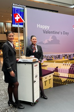 Two SWISS employees standing by the photobooth