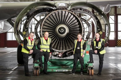 SWISS Technics Team standing in front of an engine