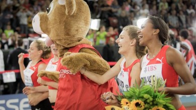 Several athletes holding hands