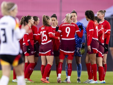 Ana-Maria Crnogorcevic talks to goalkeeper Elvira at Letzigrund, Zurich, during a friendly match between Switzerland and Germany. 