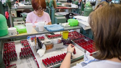 Workers at the Victorinox factory checking the knives for quality.