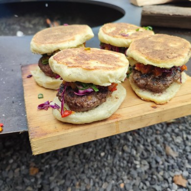 Burgers on a wooden plate