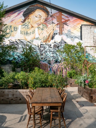 At Manuela, the most sought‑after tables are those in the lush, green courtyard.