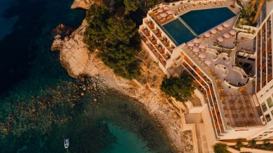 hotel complex with pool and sea