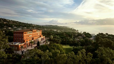 hotel complex in hillside with lake