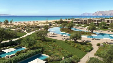hotel complex with greenery and pools and ocean view