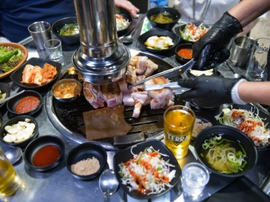 A must in Korea: traditional Korean barbecue (K-BBQ) with grilled pork.
