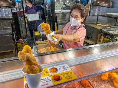 One specialty is kkwabaegi, twisted doughnuts that are also available at Gwangjang Market.