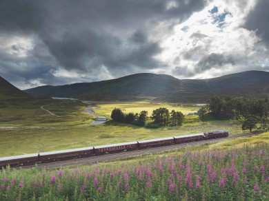 The Royal Scotsman makes its way through the stunning Scottish Highlands, offering passengers a scenic journey through one of the most beautiful landscapes.