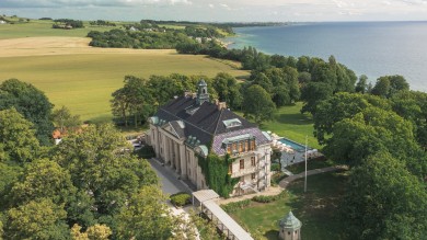 Maryhill Estate rises gracefully amid the rolling hills and farmland of Skåne, offering guests stunning sea views and a peaceful retreat in southern Sweden.