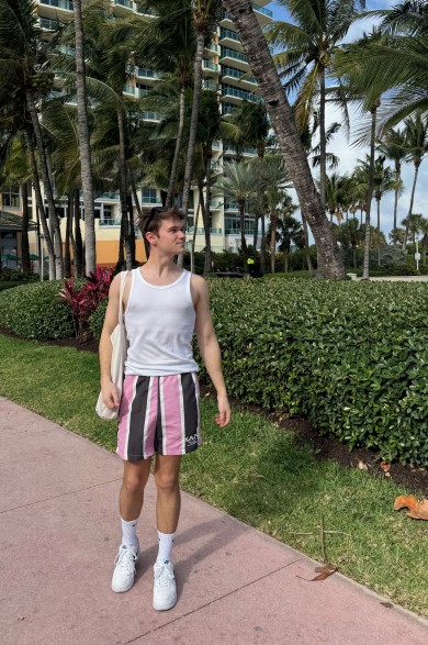 Yanic enjoys strolling along Ocean Drive, making his way toward the nearby beach and taking in the vibrant atmosphere.